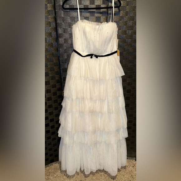 Floor-sweeping tulle, faux pearls, & a velvet belt pull this gorgeous look - Picture 2 of 6